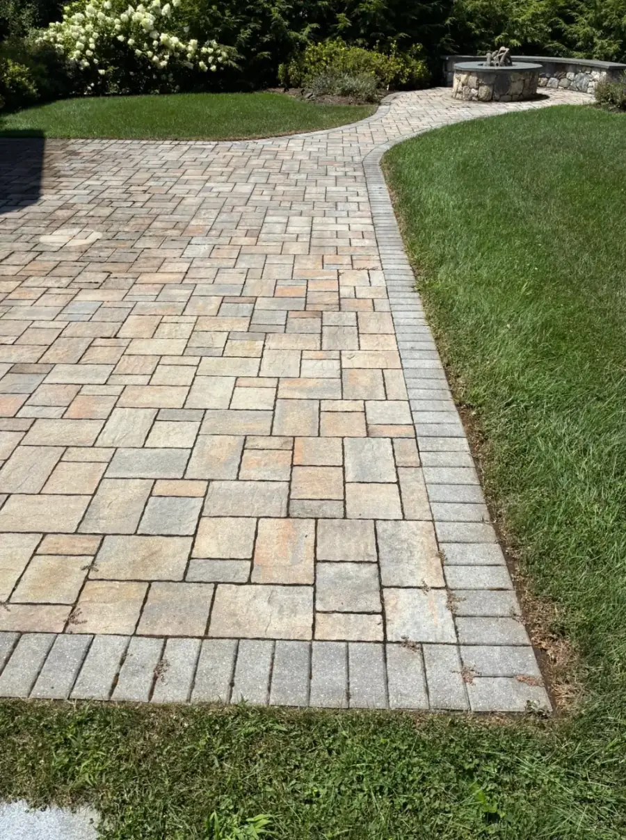 Paver patio in Worcester County, MA after irrigation rust stain removal — Pro Pressure Washing